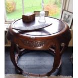 A good Oriental Hardwood Urn Table with a carved edge. 70cm diameter.