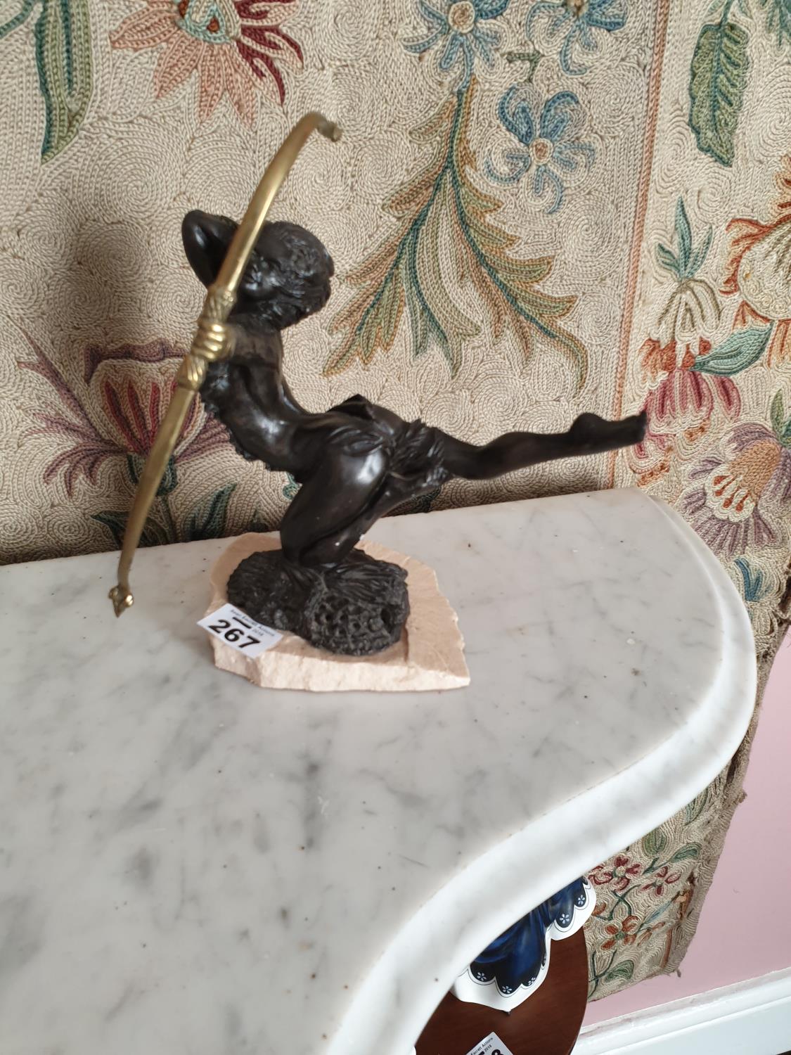 A Bronzed Figure of Diana the Huntress on a slate style base.