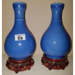A pair of Blue Oriental Vases on stands. H20 x 11cm diameter