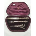 A really good cased Grape set to include a Scissors, Knife and Fork. Retailed by R W Nix and Co,