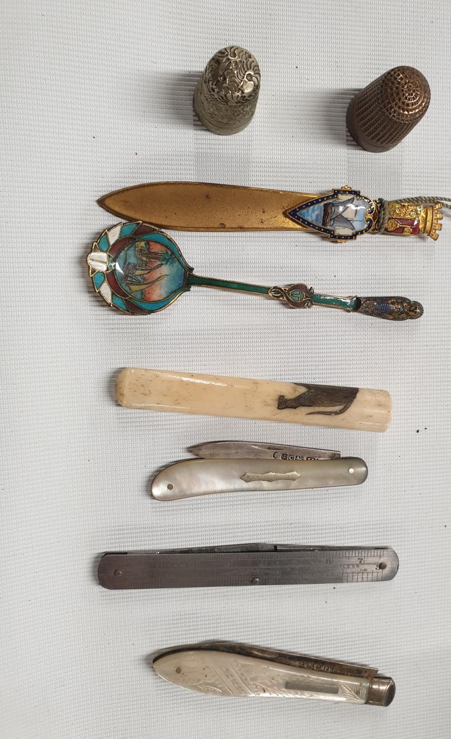 Two silver and mother of pearl fruit Knives, an eastern Spoon and other items.