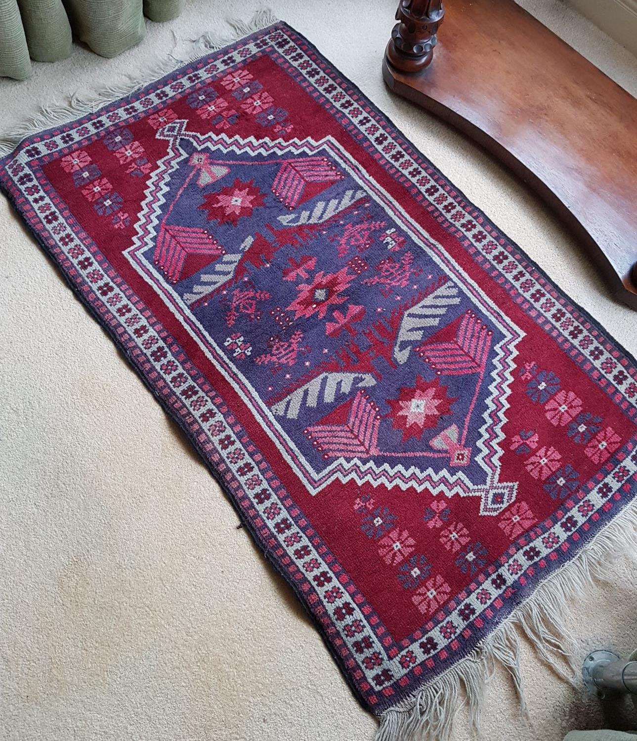 A small Eastern Tribal Rug.