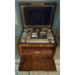 A 19th Century Walnut Vanity box with fitted interior with London silver lids. 31 cms x 21 cms high.