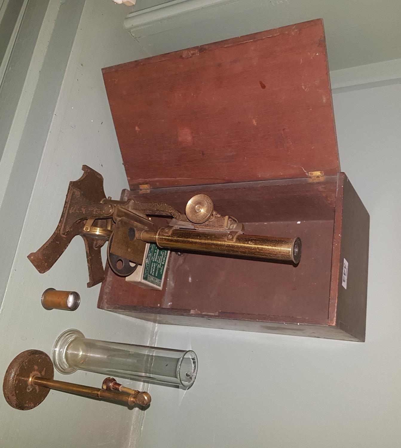 A 19th Century Brass Microscope with timber case and accessories.