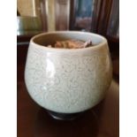 An Oriental pot.