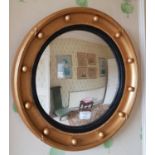 A 19th Century Timber Gilt circular Mirror with ball decoration. 40cm diameter.