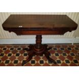 A Regency Rosewood Foldover Card Table with centre shaft two scissors movement base on brass toe