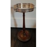 An unusual Silver topped Side Table on a circular base.