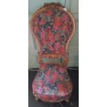 A 19th Century Mahogany high back Chair with carved outline and floral upholstery.