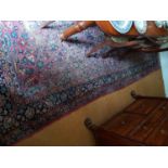 A good Eastern Carpet with allover decoration and multi borders.