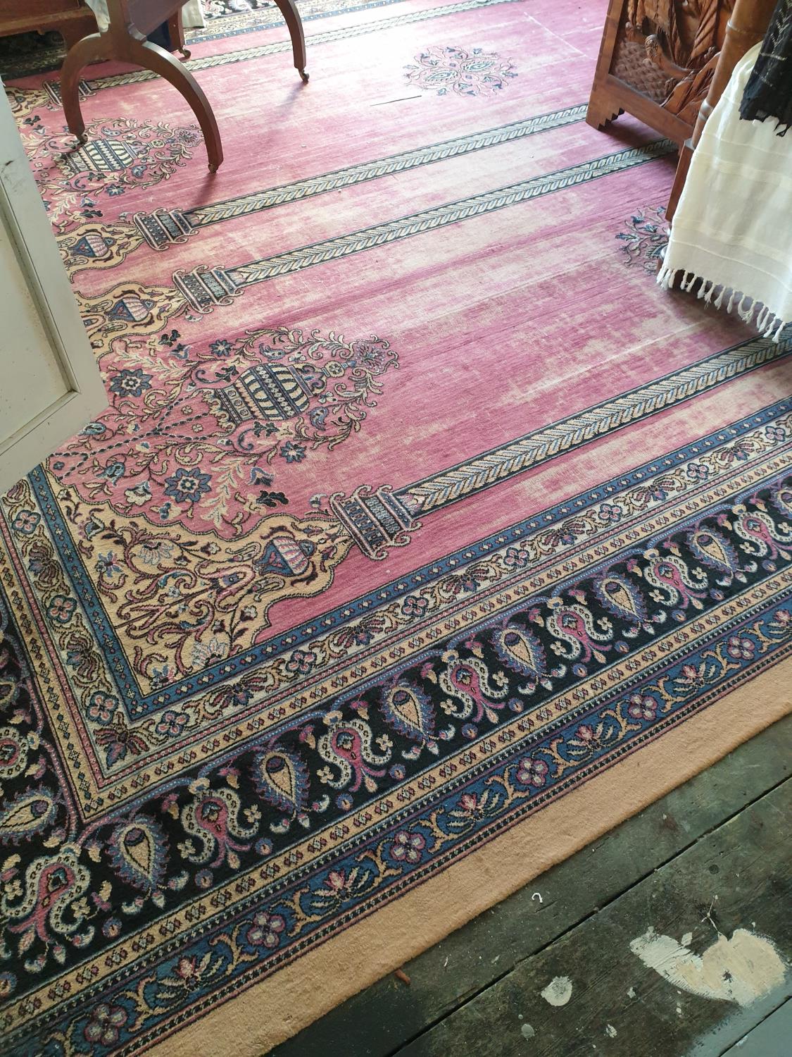 A large Cream and pink Ground Rug with multi borders and allover decoration.