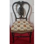 A 19th Century Ebonised Chair with a tapestry seat.