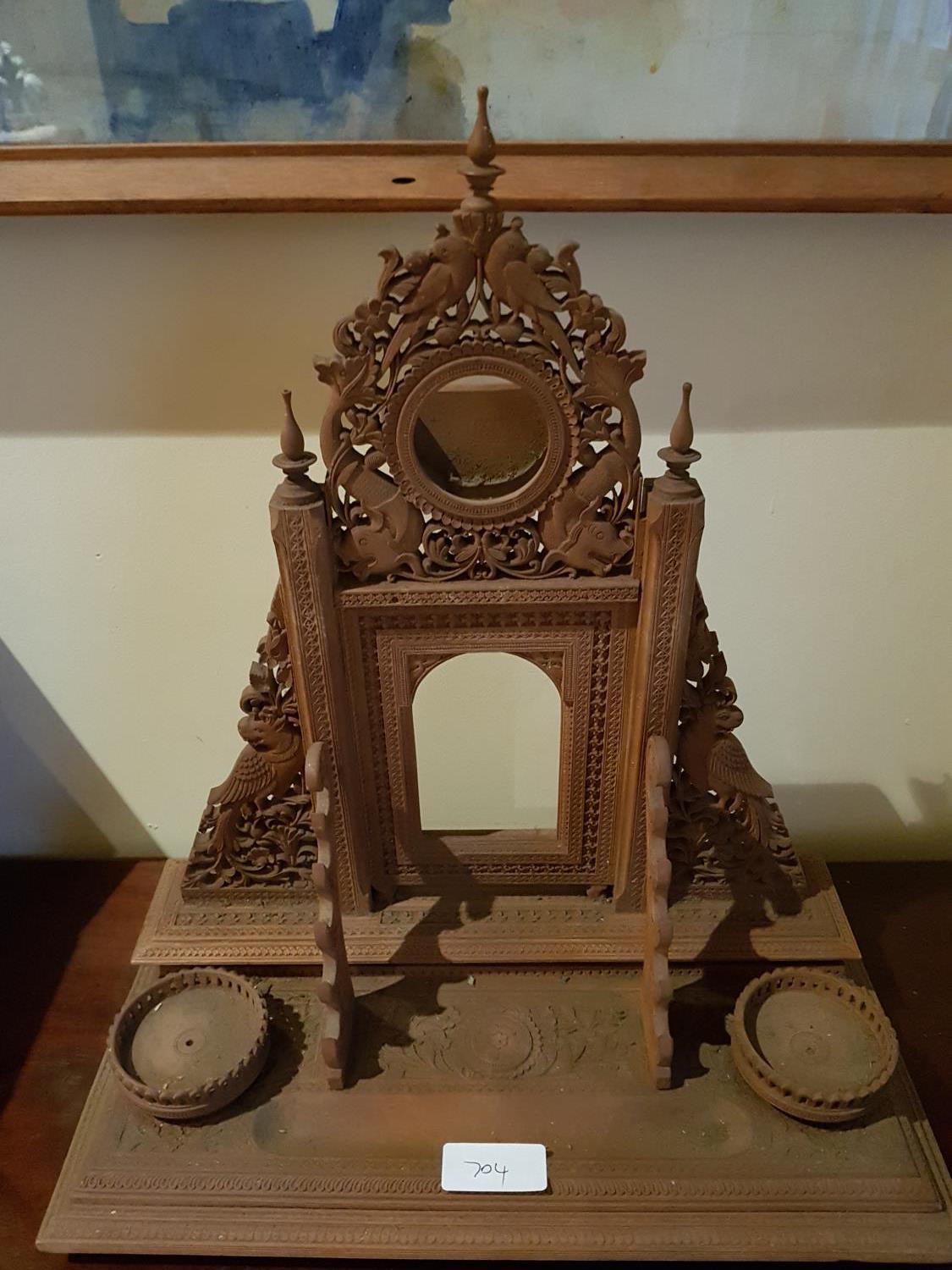 A fabulous late 19th early 20th Century Indian Desk Set with highly carved back on plinths base.