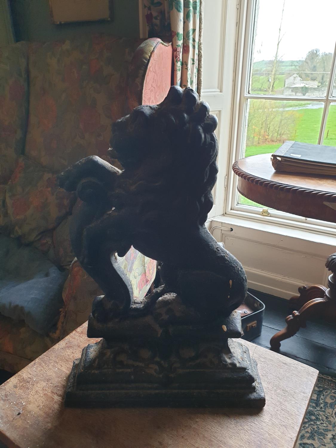 A cast iron Door Stop in the form of a Lion.