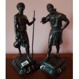A good pair of Bronze Figures of African Men on marble bases. 34cm.