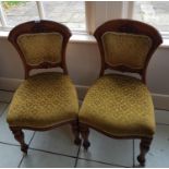 A lovely set of Oak Dining Chairs with padded backs and seats.