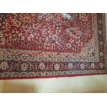 A good Wool Rug with allover decoration and multi borders.