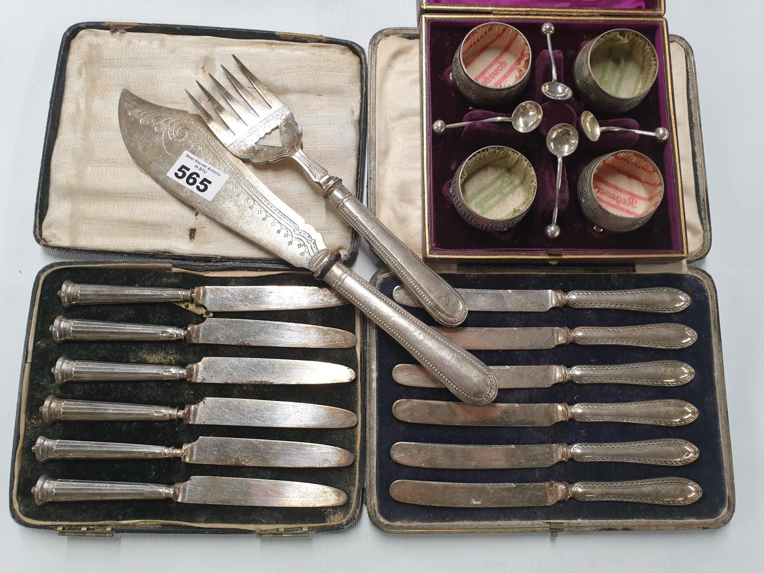 Two sets of silver handled Knives along with a Fish serving set and a cased set of Salts.