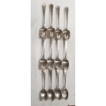 A matched set of twelve Silver Dessert Spoons primarily George Smith third & William Fearn, latter