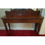 A William 1Vth Mahogany Irish Side Table with a shell back.