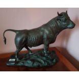 A Bronze Figure of a Bull in a serious stance. 32cm.