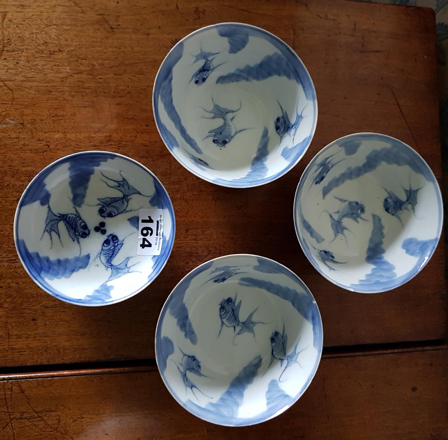 A good set of four early Chinese Bowls. large 11.5cm small 10.5cm.