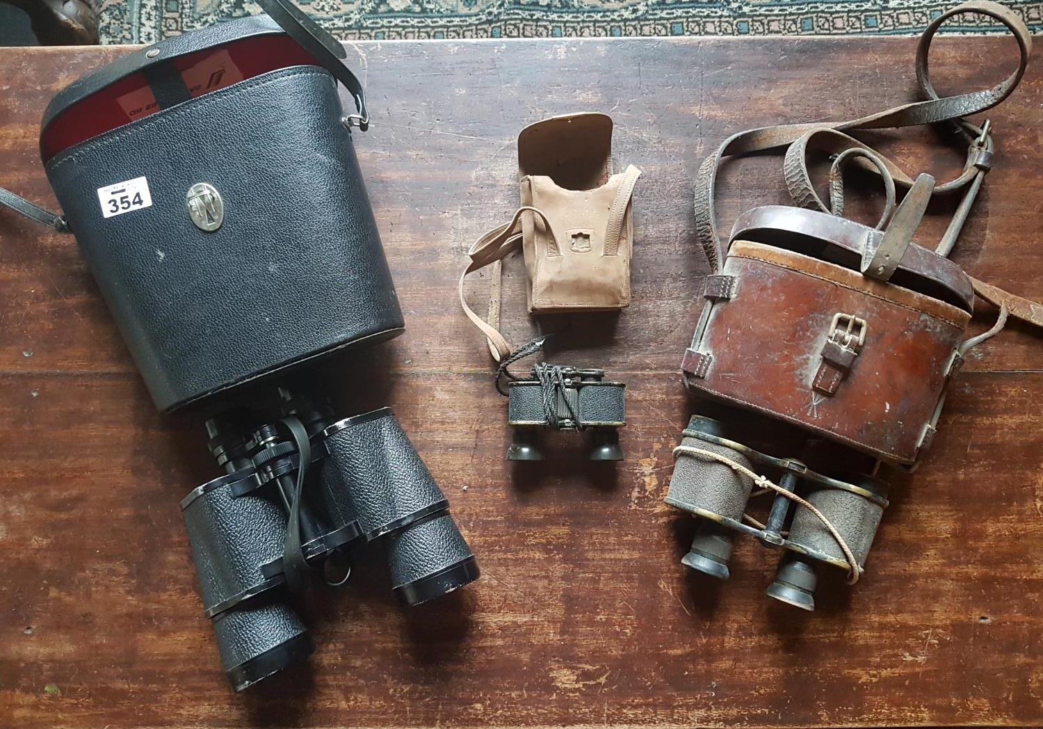 A pair of Sonam Binoculars along with a pair of opera glasses.