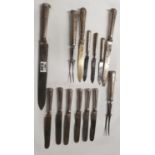 A set of Silver pistol handled Butter Knives along with other carving knives etc.