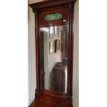 A fantastic 19th Century Mahogany Pier Mirror with a painted panel top and columned outline. Circa
