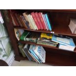 A quantity of Books in bookcase.