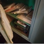 A quantity of Books in cabinet.