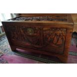 A large highly carved Camphor Wood Chest profusely carved all over with scenes from Hong Kong. 111 x