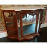 A 19th Century serpentine fronted Credenza with a marble top and single mirrored front door. W136