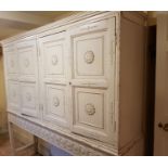 A fantastic 19th Century Painted Pine four door Cabinet on stand with gesso mounts.