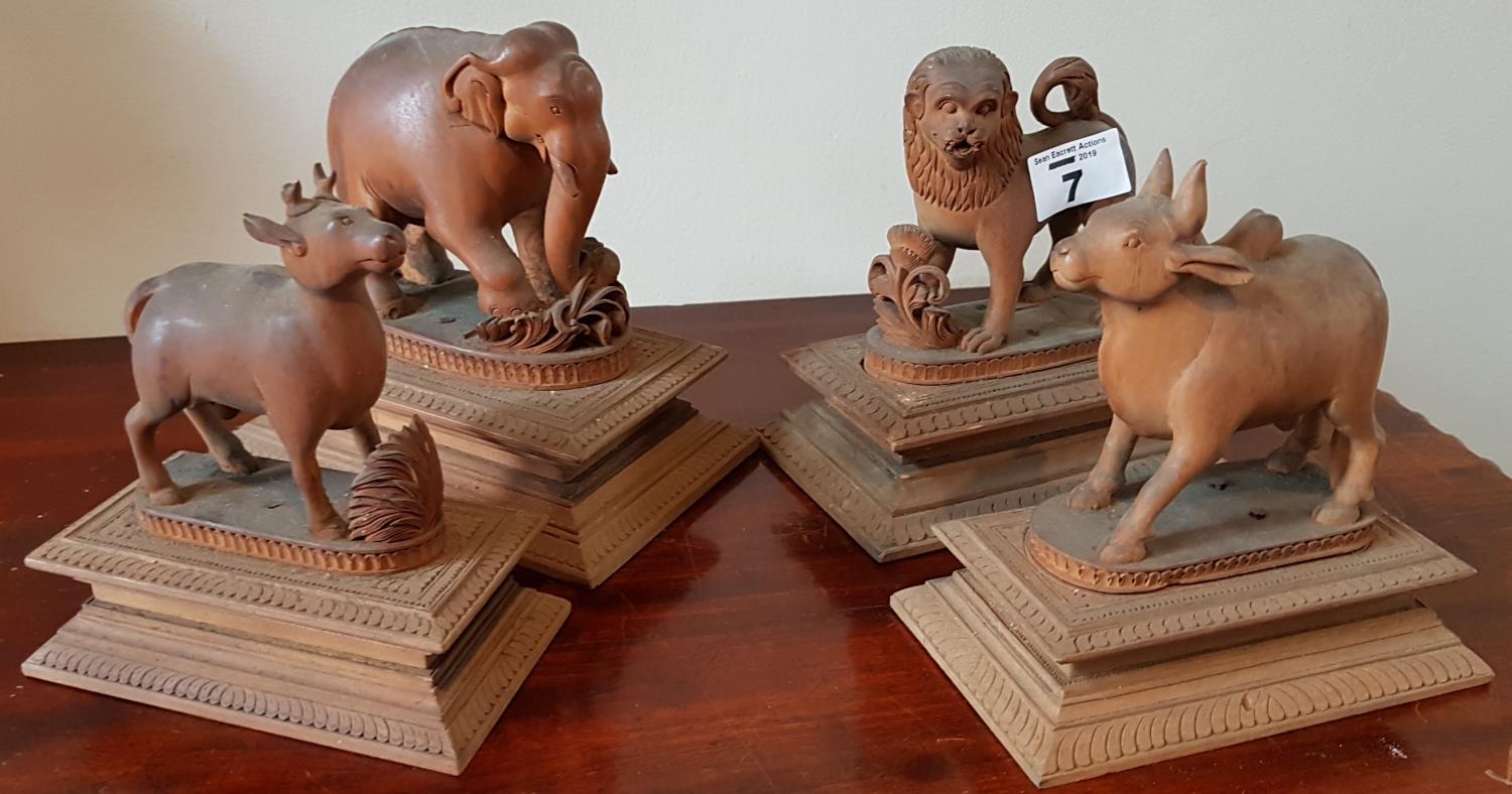 Four quite rare 19th Century Hardwood Figures of Animals on plinth bases. Early 20th Century