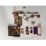 A group of Medals and Military items.