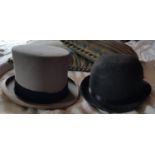 A Moss Bros. Top Hat and a Bowler Hat.
