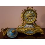 A 19th Century Ormolu Mantel Clock with sevres style panels. (AF).