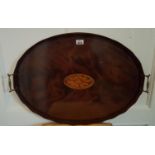 An Edwardian Mahogany Inlaid oval Tray with a shell inlaid top.