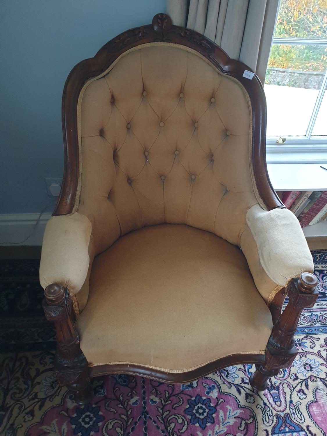 A 19th Century Walnut Showframe Tub Chair with deep buttoned back on turned supports.