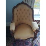 A 19th Century Walnut Showframe Tub Chair with deep buttoned back on turned supports.