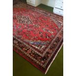 A full pile Persian Seruk Village Carpet with floral design.Size W 208 x L 293cms.