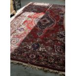 An Indian heavy pile Rug with traditional Red Ground.Size W 201 x L 300cms.