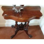A superb Victorian Walnut and Burr Walnut Foldover Card Table with serpentine outline.