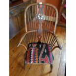 A 19th Century Windsor Armchair with a spindle back.