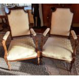 A lovely pair of 19th Century Walnut Armchairs with gilt decoration and turned fluted supports.