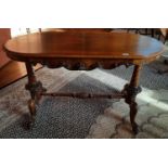A really good Victorian Walnut Centre Table with turned and carved end supports and legs.