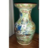 An Oriental Vase profusely decorated with Butterflies and Flowers.
