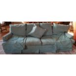 A large classical three seater Couch with green upholstery. 240 cms wide.