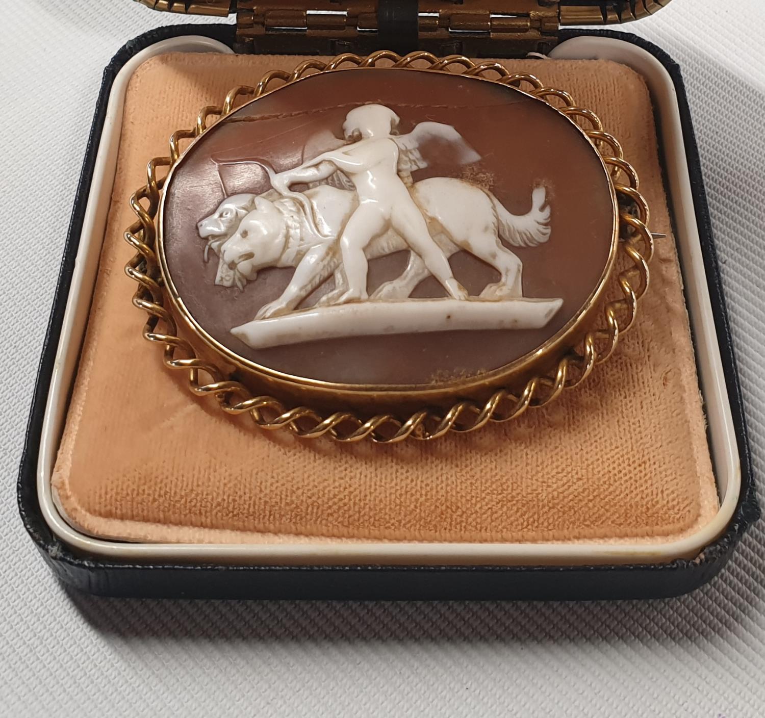 A really good gold Cameo Broach.